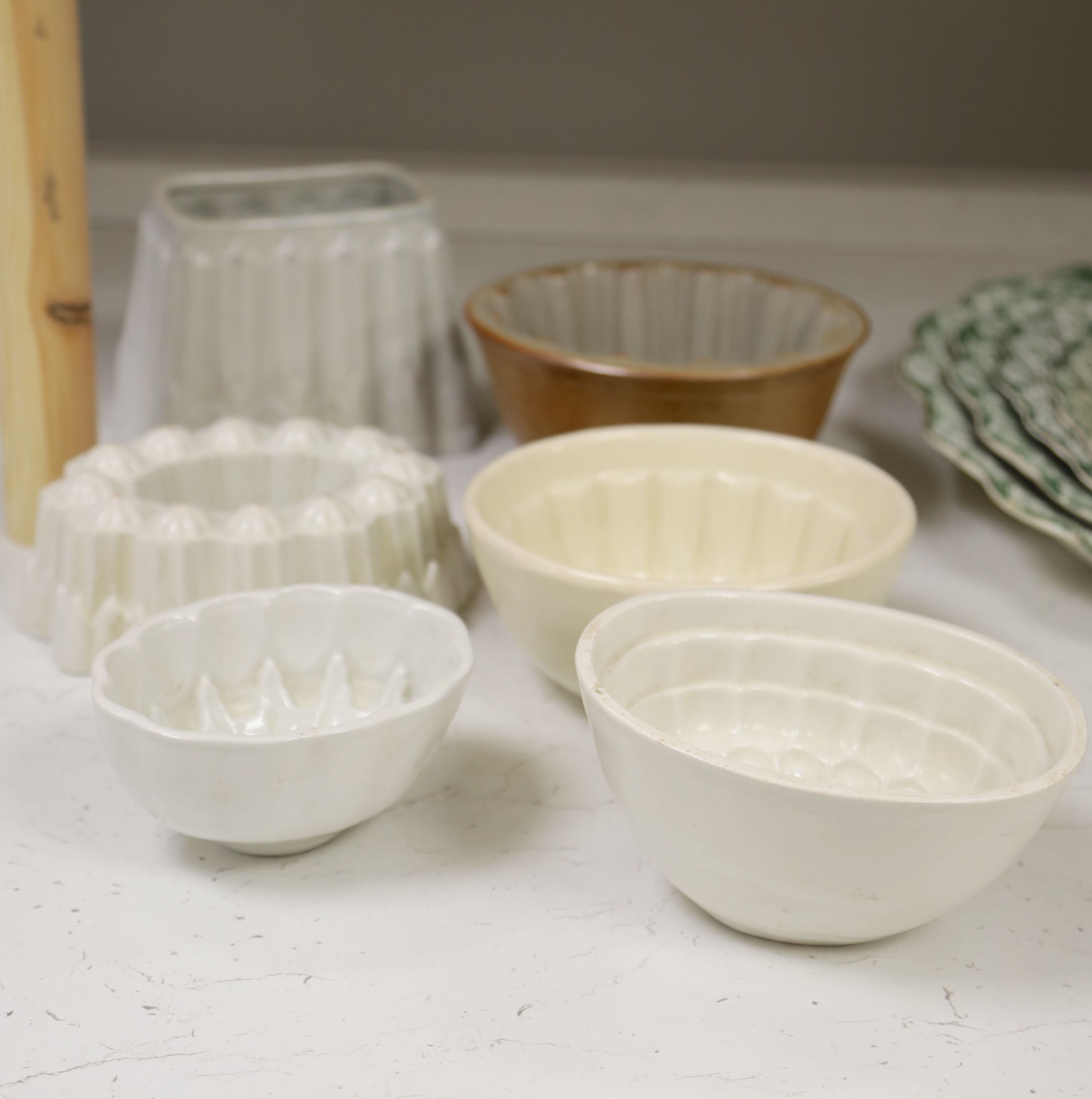 Six pottery jelly moulds including one Shelley